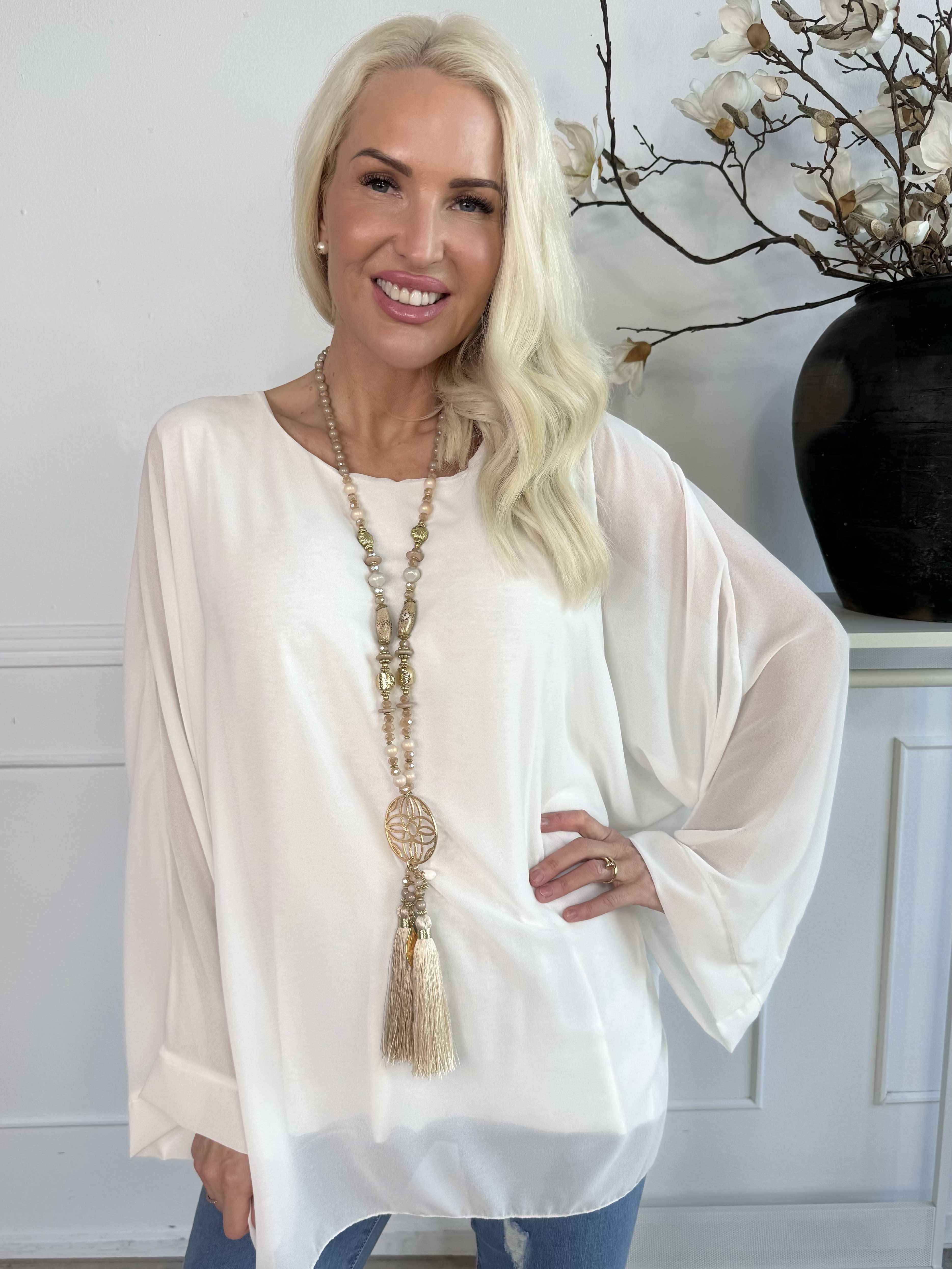 Flores - Tunika med chiffonglager och halvgenomskinliga ärmar